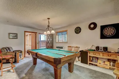 a living room with a pool table in it at Bear Haus - Fur babies welcome in South Lake Tahoe