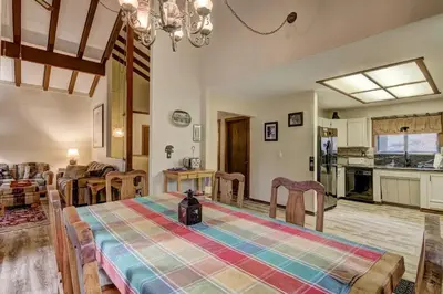a kitchen and living room with a table and chairs at Bear Haus - Fur babies welcome in South Lake Tahoe