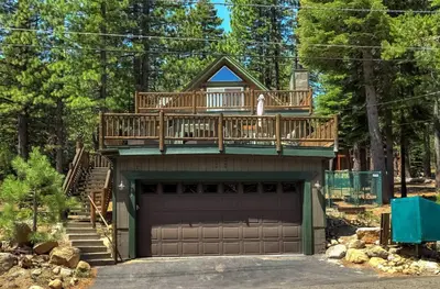 a house with a deck on top of a garage at Bear Pause 4BR - Large Deck & Balcony in South Lake Tahoe