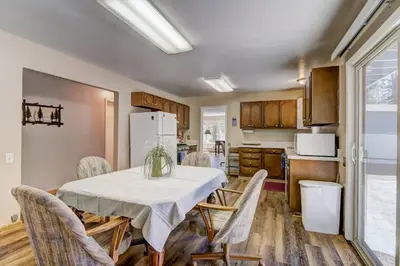 a kitchen and dining room with a table and chairs at Blue Black Bart - Foosball Near Town & More in South Lake Tahoe