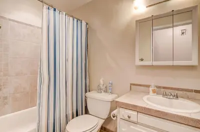 a bathroom with a toilet and a sink at Blue Black Bart - Foosball Near Town & More in South Lake Tahoe