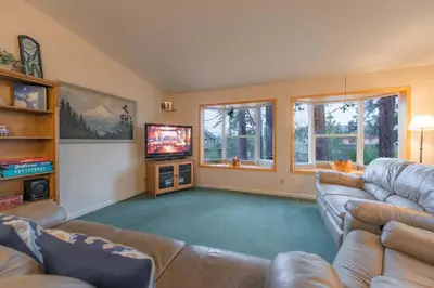 a large living room with couches and a television at Elk Forest Escape - Economy Family Abode in South Lake Tahoe