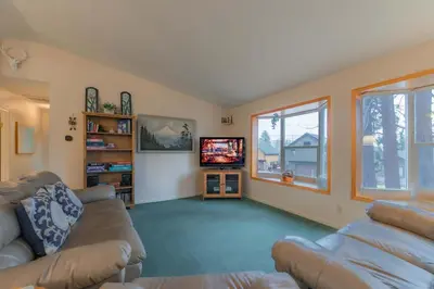 a living room with a couch and a tv at Elk Forest Escape - Economy Family Abode in South Lake Tahoe