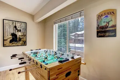 a large game room with a foosball table at Nestled Pines Retreat Hot Tub Pool Tahoe Foosball More in South Lake Tahoe