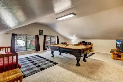 a living room with a pool table in it at Paloma Place Lakeview Home Hot Tub Game Room in South Lake Tahoe