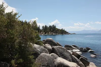 a group of rocks on the shore of a body of water at Prima Del Norte - Hot tub Pool Table Arcade Game in South Lake Tahoe