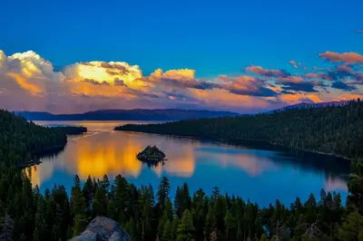 a view of a lake at sunset with trees at Prima Del Norte - Hot tub Pool Table Arcade Game in South Lake Tahoe
