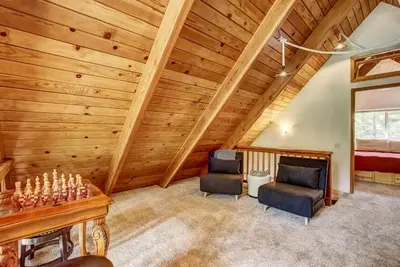 two chairs in a room with wooden walls at Rustic Haven - Hot tub & Pet friendly in South Lake Tahoe