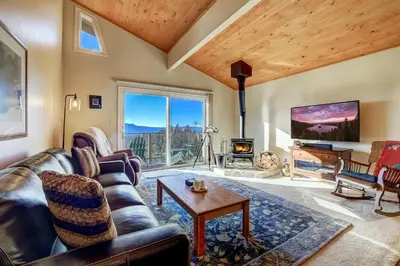 a living room with a couch and a fireplace at Scenic Escape - BEST views of Lake Tahoe in Stateline