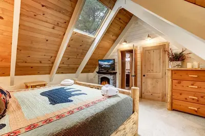 a bedroom with a bed and a fireplace at Serenity Woods - Game Room & More in South Lake Tahoe