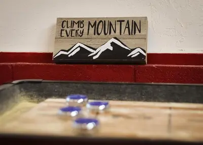 a sign that says cuillin every mountain on a wall at Serenity Woods - Game Room & More in South Lake Tahoe