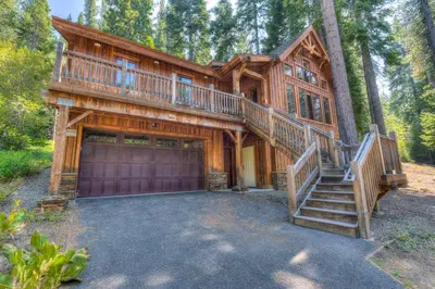 a large wooden house with a large garage at Shining Shire - Sauna steam shower very cool in South Lake Tahoe