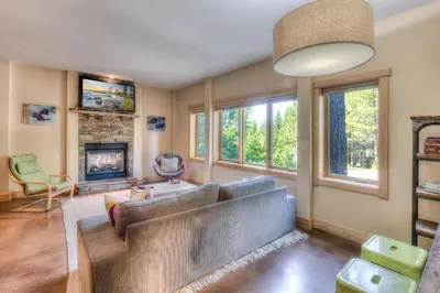 a living room with a couch and a fireplace at Shining Shire - Sauna steam shower very cool in South Lake Tahoe