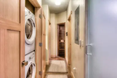 a laundry room with a washer and dryer at Shining Shire - Sauna steam shower very cool in South Lake Tahoe
