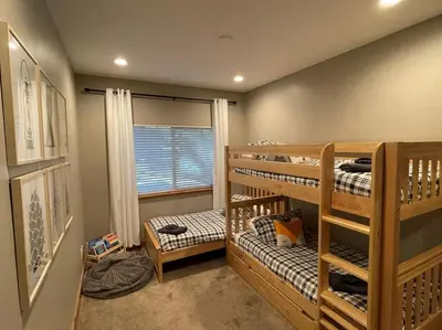 a room with two bunk beds and a window at It's a Sierra State of Mind - Family Fun in South Lake Tahoe