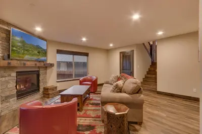 a living room with a couch and a fireplace at Silver Pines - Ski or Summer 30 plus day home in South Lake Tahoe