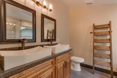 a bathroom with two sinks and a toilet at Silver Pines - Ski or Summer 30 plus day home in South Lake Tahoe