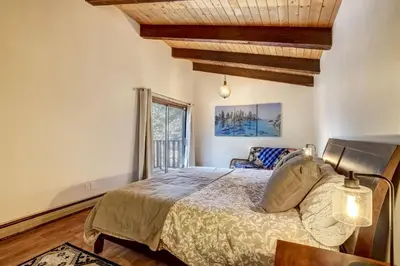 a bedroom with a bed and a window at Singing Pines in Marla Bay - Walk to Lake in Glenbrook