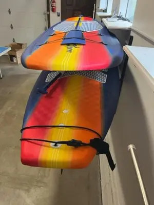 two surfboards hanging on a wall in a room at Singing Pines in Marla Bay - Walk to Lake in Glenbrook