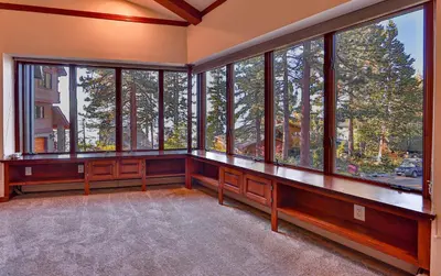 an empty room with a large group of windows at Sunset Cove Chic Tahoe Retreat in Glenbrook