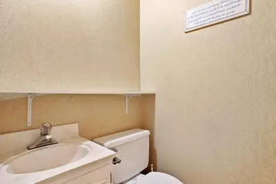 a bathroom with a sink and a toilet at Tahoe Forest Chalet 3BR House with AC in Stateline