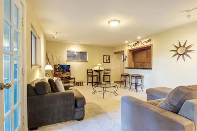 a living room with two couches and a table at Mountainside Overlook Lake Views & Hot Tub in Kings Beach