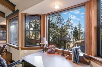 an office with a desk and a large window at Mountainside Overlook Lake Views & Hot Tub in Kings Beach