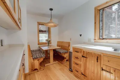 a small kitchen with a sink and a table at North Lake Hideaway Prime Locale for Outdoor Fun in Alpine Meadows