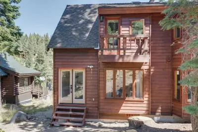 a log cabin with a staircase leading to the front door at North Lake Hideaway Prime Locale for Outdoor Fun in Alpine Meadows