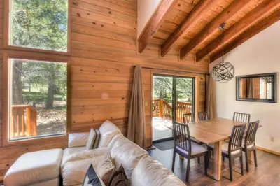 a living room with a couch and a table at Northwoods Hangout Near Tahoe Donner in Truckee