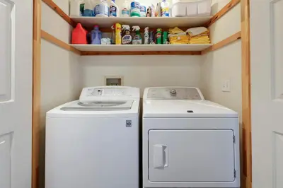a washer and dryer in a small laundry room at Paradise Pines 3BR Secluded Cabin Minutes in Tahoe Donner in Truckee