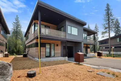 a house with a pole in front of it at Enjoy Paradise Hot Tub Bike & Beach Equipment in Olympic Valley