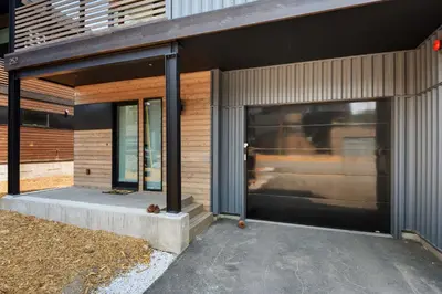 an entrance to a building with a large glass door at Enjoy Paradise Hot Tub Bike & Beach Equipment in Olympic Valley