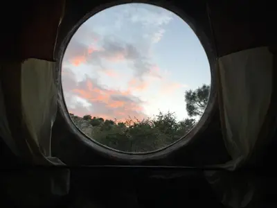 a round window in a building with a sky at Lord of the rings palice in Wofford Heights
