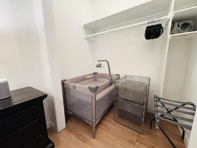 a bathroom with a sink in the corner of a room at Downtown-Pool,Firepit,Trees, WFH-No gate fee like PML in Groveland