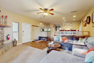 a living room with a couch and a ceiling fan at The Tahoe Nest in Incline Village