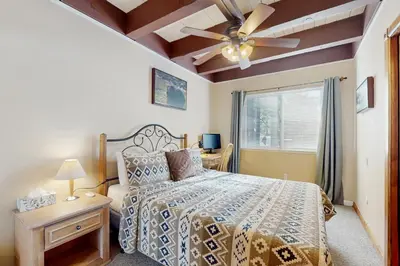 a bedroom with a bed and a ceiling fan at The Tahoe Nest in Incline Village