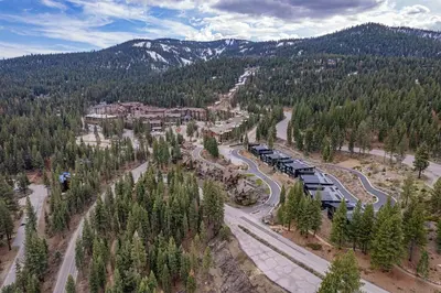 an aerial view of a train traveling down a road at Village Walk 7470 by East West Hospitality in Truckee
