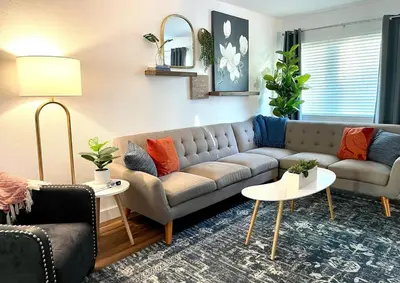 a living room with a couch and two tables at Remodeled Excellent Neighborhood in Roseville