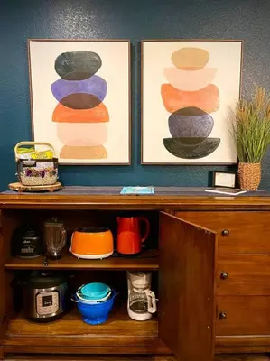 a wooden cabinet with two pictures on top of it at Remodeled Excellent Neighborhood in Roseville