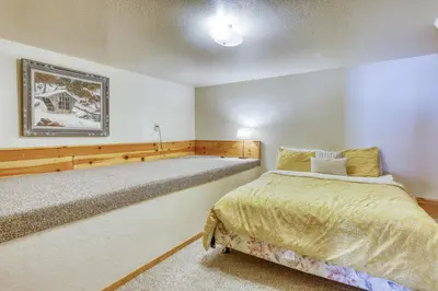 a bedroom with two beds in a room at Resting Bear Lodge by Tahoe Getaways - Pet Friendly w Foosball and HOA Amenities in Truckee