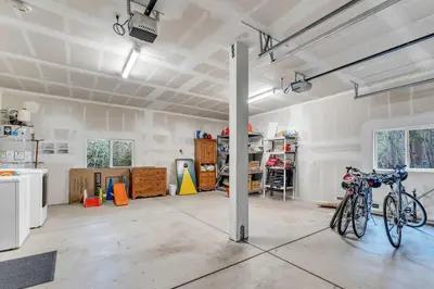 a garage with bikes parked in it at Tahoma Family Getaway with Bocce Ball & BBQ Grill in Tahoma