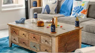 a coffee table with two bottles of beer on it at Ski Way by AvantStay Cozy Tahoe Home w Fireplace Balcony in Incline Village