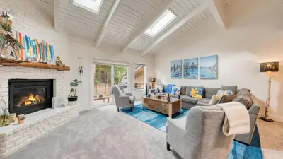 a living room with a couch and a fireplace at Ski Way by AvantStay Cozy Tahoe Home w Fireplace Balcony in Incline Village