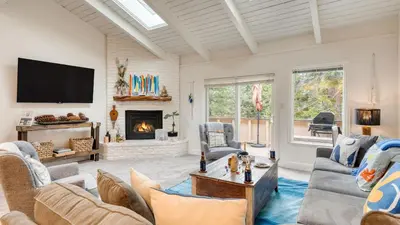 a living room with a couch and a fireplace at Ski Way by AvantStay Cozy Tahoe Home w Fireplace Balcony in Incline Village