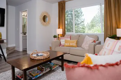 a living room with a couch and a table at Gorgeous views 1st Apple hill exit Family Fun in Placerville