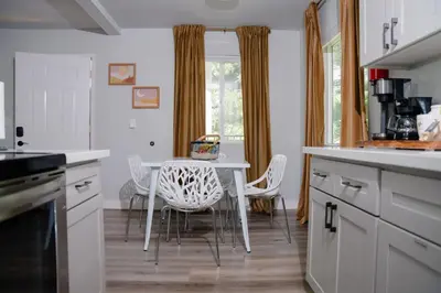 a kitchen with a table and chairs and a window at Gorgeous views 1st Apple hill exit Family Fun in Placerville
