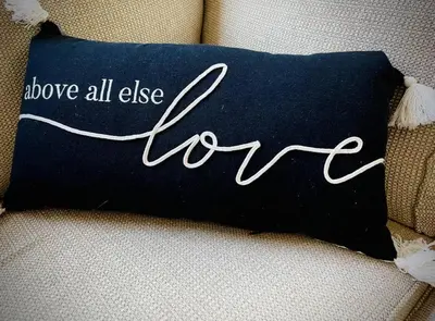 a pillow that says above all else new on a couch at Enjoy the outdoors 1st Apple hill exit Tahoe in Placerville