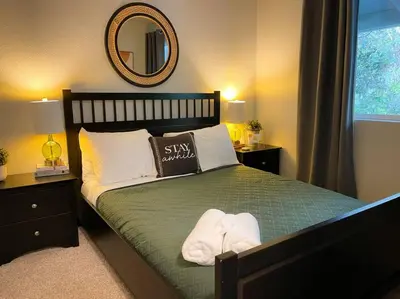 a bedroom with a bed with two towels on it at Enjoy the outdoors 1st Apple hill exit Tahoe in Placerville