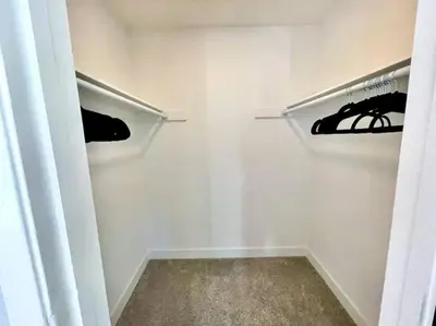 a bathroom with a closet with a rack of clothes at Enjoy the outdoors 1st Apple hill exit Tahoe in Placerville